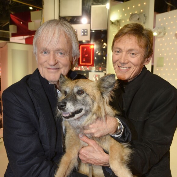 Dave et son compagnon Patrick Loiseau avec leur chien, lors de l'enregistrement de Vivement Dimanche à Paris le 24 février 2016. © Coadic Guirec