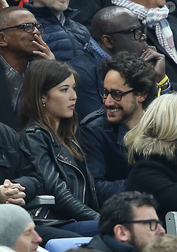 Thomas Hollande et sa compagne, dans les tribunes de la rencontre finale de la Coupe de la Ligue PSG-Lille au Stade de France à Paris, le 23 avril 2016.