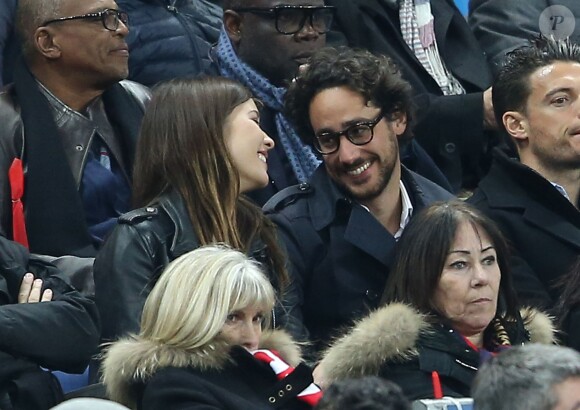 Thomas Hollande et sa compagne, dans les tribunes de la rencontre finale de la Coupe de la Ligue PSG-Lille au Stade de France à Paris, le 23 avril 2016.
