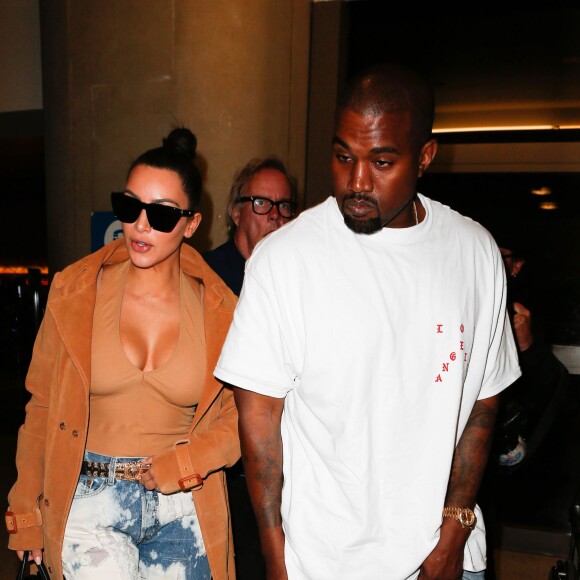 Kim Kardashian et Kanye West à l'aéroport LAX de Los Angeles, le 19 mai 2016.
