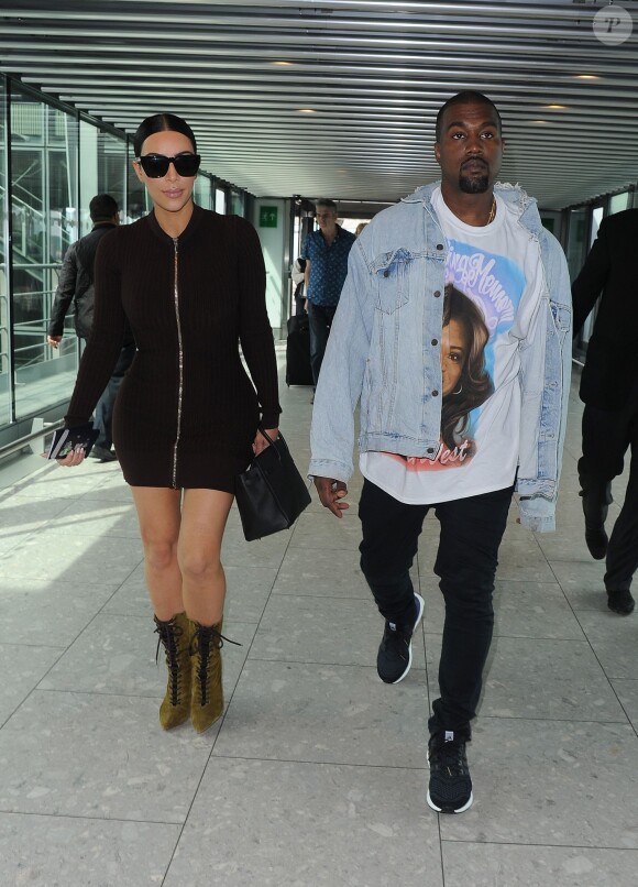Kim Kardashian et son mari Kanye West arrivent à l'aéroport d'Heathrow à Londres, le 22 mai 2016.