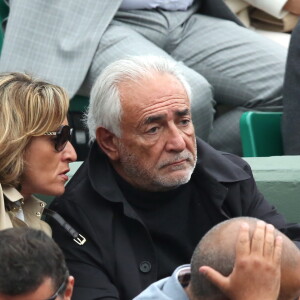 Dominique Strauss Kahn et sa compagne Myriam L'Aouffir dans les tribunes de la finale homme des internationaux de France de Roland-Garros à Paris le 5 juin 2016. © Moreau-Jacovides / Bestimage