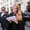 Céline Dion quitte l'hôtel Royal Monceau sous l'oeil amusé de ses jumeaux Eddy et Nelson à Paris le 15 juin 2016.