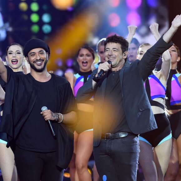 Exclusif - Slimane, à gauche, et Patrick Bruel lors de l'émission de télévision pour TF1 "La Chanson de l'Année 2016" à Nîmes le 17 juin 2016. © Bruno Bebert / Bestimage