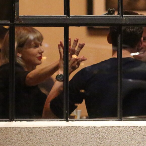 Singer, Taylor Swift, and her British hunk, Tom Hiddleston, spotted out on another double date in Nashville, TN, USA. The couple seemed to be having a great time as they chatted with friends and drank some wine. Tom Hiddleston looked like a proper English gent when he was seen kissing Taylor's hand as a token of his affection. She was seen in a black turtleneck, black shorts, Louis Vuitton handbag, and flats, on June 23, 2016. Photo by GSI/ABACAPRESS.COM24/06/2016 - Nashville