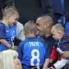 Dimitri Payet avec ses fils Noa et Milan - Les joueurs retrouvent leur famille dans les tribunes à la fin du match de quart de finale de l'UEFA Euro 2016 France-Islande au Stade de France à Saint-Denis le 3 juillet 2016. © Cyril Moreau / Bestimage Please hide children's face prior to the publication - French Players reunited with their families in the stands at the end of the quarter-final match of UEFA Euro 2016 France-Iceland at the Stade de France in Saint-Denis July 3, 2016.03/07/2016 - Saint-Denis