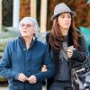 Exclusif - Bernie Ecclestone se promène avec sa femme Fabiana Flosi et des amis dans les rues de Gstaad pendant leurs vacances. Le 22 décembre 2014
