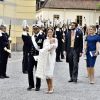 Le prince Carl Philip et la princesse Sofia de Suède lors du baptême de leur fils, le prince Alexander de Suède, au palais Drottningholm à Stockholm le 9 septembre 2016, suivis par Victor Magnuson (parrain) et Lina Hellqvist (marraine).