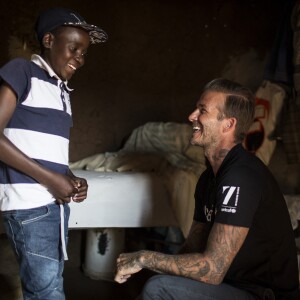 David Beckham, ambassadeur de bonne volonté de l'UNICEF rend visite à des enfants séropositifs en Afrique du Sud le 7 juin 2016.