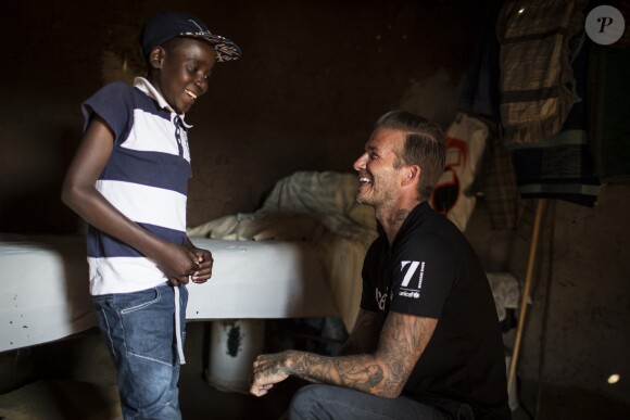 David Beckham, ambassadeur de bonne volonté de l'UNICEF rend visite à des enfants séropositifs en Afrique du Sud le 7 juin 2016.