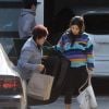 Les jeunes mariés Steven Yeun et Joana Pak se baladent dans les rues de Los Angeles. Joana a le ventre rond, serait-elle enceinte.. Le 5 décembre 2016