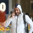 Karim Benzema arrive à l'aéroport Roissy CDG en survêtement blanc le 23 juin 2015.