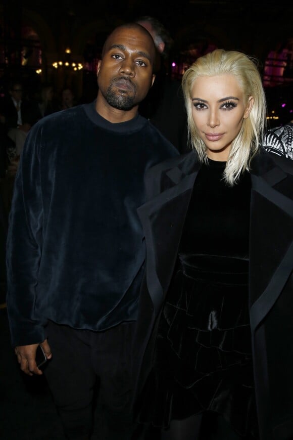 Kanye West et sa femme Kim Kardashian (blonde) - People au défilé de mode "Balmain" prêt-à-porter Automne-Hiver 2015-2016 au Grand Hôtel à Paris, le 5 mars 2015.