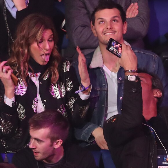 Laury Thilleman, avec à ses côtés son compagnon Juan Arbelaez, fait la folle avec Jean-Luc Reichmann en train de la filmer lors du match d'ouverture du Mondial de handball 2017, France-Brésil (31-16), à l'AccorHotels Arena à Paris le 11 janvier 2017. © Cyril Moreau/Bestimage