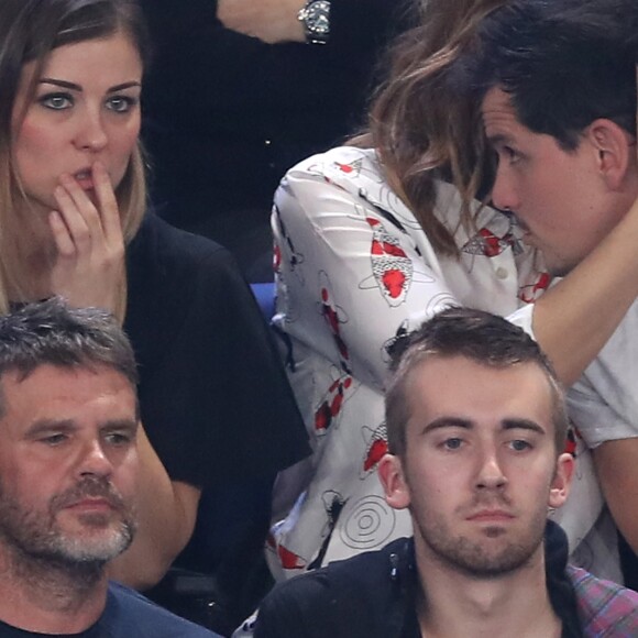 Laury Thilleman et Juan Arbelaez, installés un rang derrière Hervé Mathoux et Jean-Luc Reichmann lors du match d'ouverture du Mondial de handball 2017, France-Brésil (31-16), à l'AccorHotels Arena à Paris le 11 janvier 2017. © Cyril Moreau/Bestimage