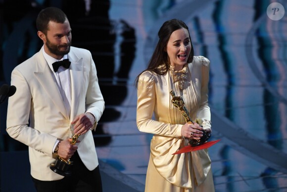 Feb 26, 2017; Hollywood, CA, USA; Jamie Dornan (L) and Dakota Johnson present the award for Achievement in production designduring the 89th Academy Awards at Dolby Theatre, Los Angeles, CA, USA on February 26, 2017. Photo by Robert Deutsch/USA TODAY NETWORK/DDP USA/ABACAPRESS.COM27/02/2017 - Los Angeles