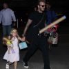 La famille Beckham arrive à l'aéroport de LAX à Los Angeles. David Beckham tient la main de sa fille Harper, Brooklyn marche aux côtés de sa mère Victoria et le petit Cruz porte tout seul sa guitare XXL, le 29 août 2016.