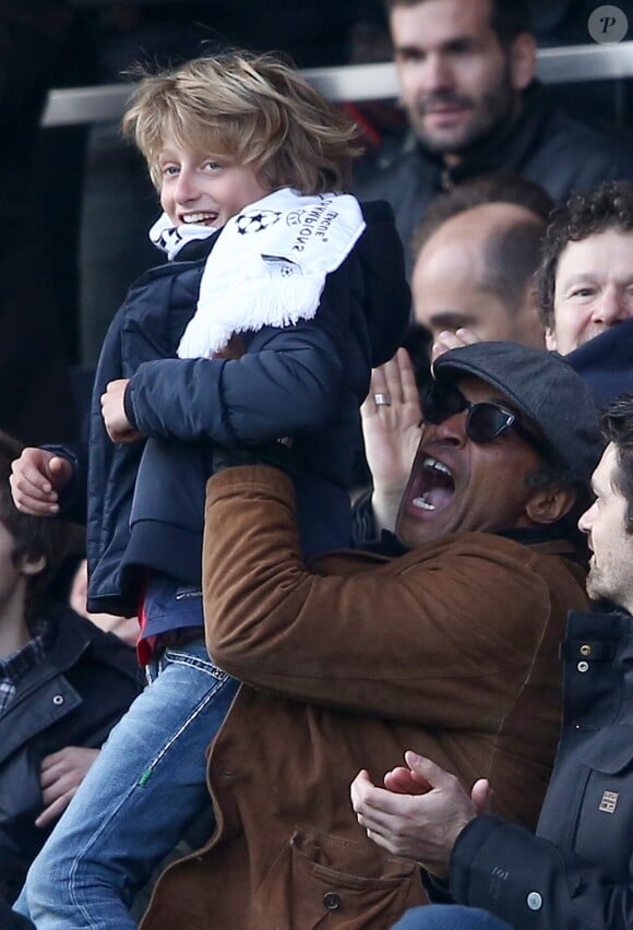Yannick Noah et son fils Joalukas - People au match de de la ligue 1 entre le PSG et Evian au Parc des Princes à Paris le 18 janvier 2015.