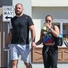 Exclusif - No Web - La championne de MMA Ronda Rousey et son compagnon Travis Browne marchent vers la salle d'entrainement de Ronda à Glendale le 8 mars 2016.