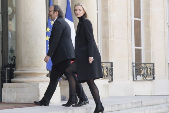 Xavier Niel (directeur de Iliad et copropriétaire du groupe Le Monde) avec sa compagne Delphine Arnault à l'Elysée lors de la remise de l'insigne de Commandeur de la Légion d'Honneur à B. Gates et sa femme Melinda. Paris, le 21 avril 2017.