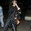 Rihanna arrive à l'aéroport de LAX à Los Angeles. Elle porte un jogging et des mules en fourrure de la marque Puma. Le 24 avril 2017