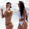 Kim Kardashian et son assistante Stephanie Sheppard - Exclusif - Prix spécial - No web - No blog - Kim Kardashian en maillot de bain sur une plage au Mexique. Kim passe des vacances en compagnie d'amies, de son assistante Stephanie Sheppard et de sa soeur K.Kardashian. Kim porte un maillot de bain de la marque Christian Dior. Le 23 avril 2017  Exclusive - Kim Kardashian's assistant Stephanie Sheppard wows in a white two piece while enjoying a vacation with her boss in Mexico on April 23, 2017. Steph looks great in the while ensemble as she sip a beer and strolls the beach with Kim, who apparently did not feel like having a drink.23/04/2017 - Mexico