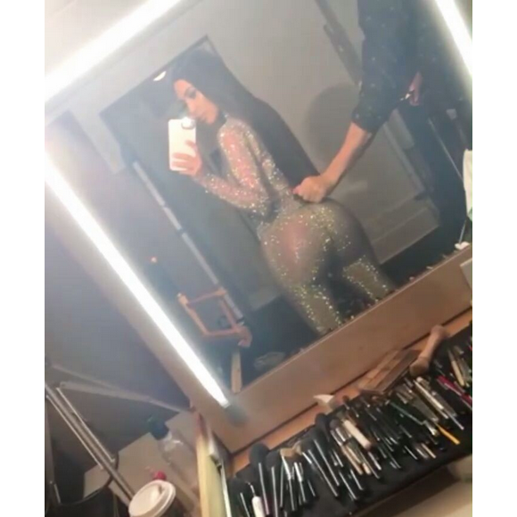 Photo de Kim Kardashian, habillée d'un haut et d'un legging en résille Gucci. Août 2017.