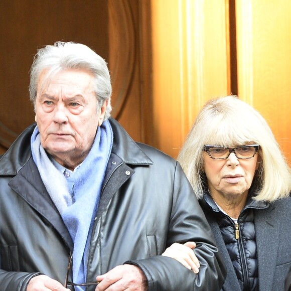 Alain Delon et Mireille Darc - Hommage à Georges Lautner en l'eglise Saint-Roch à Paris. Le 5 décembre 2013