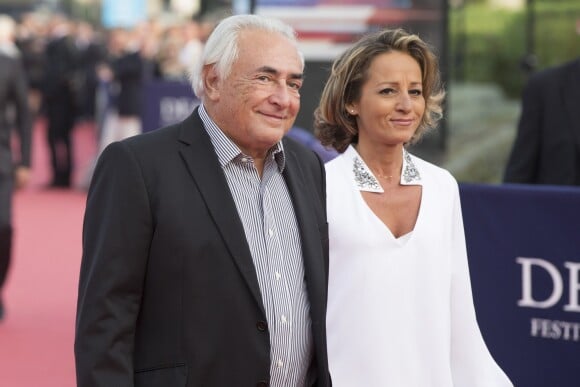 Dominique Strauss-Kahn et sa compagne Myriam L'Aouffir - Avant-première du film "Sin City 2" lors du 40e festival du cinéma américain de Deauville, le 13 septembre 2014.