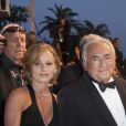 Dominique Strauss Kahn et sa compagne Myriam L'Aouffir sur le tapis rouge lors du 66e Festival du film de Cannes, le 25 mai 2013.