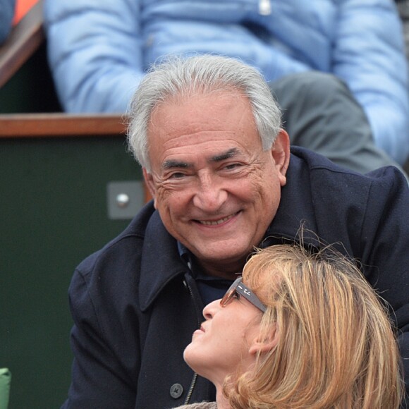 Dominique Strauss-Kahn et sa compagne Myriam L'Aouffir assistent au 8e sacre de Rafael Nadal lors des Internationaux de France a Roland Garros à Paris le 9 juin 2013.
