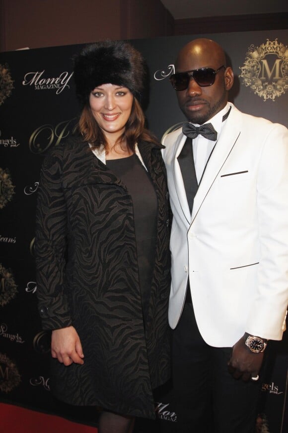 Kelly Bochenko et Omar Jeans assistent au défilé de Mode Omar Jeans, au pavillon Champs Elysées, a Paris le 31 mars 2013.