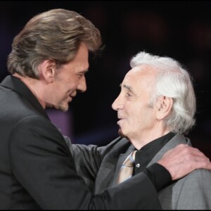 JOHNNY HALLYDAY ET CHARLES AZNAVOUR - EMISSION "LA FETE DE LA CHANSON FRANCAISE" SUR FRANCE 2 DIFFUSION LE 15 JANVIER 2005 PRESENTEE PAR DANIELA LUMBROSO 12/01/2005 - Paris