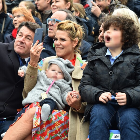 Denise Fabre, Christian Estrosi, le maire de Nice avec sa femme Laura Tenoudji, leur fille Bianca et Milan, le fils de Laura pendant la 1ère Bataille de Fleurs dans le cadre de la 134ème édition du Carnaval de Nice "Roi de l'Espace" dans la maison du Carnaval. L'évènement se déroulera du 17 février au 4 mars. Nice le 17 février 2018. Le Carnaval de Nice est l'un des trois plus grands et plus prestigieux carnavals du Monde avec Rio et Venise. © Bruno Bebert/Bestimage 