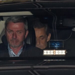 Nicolas Sarkozy et sa femme Carla Bruni-Sarkozy - Nicolas Sarkozy s'est rendu sur le plateau de TF1 lors du journal télévisé de 20 heures après sa mise en examen puis a été dîner avec sa femme Carla et son équipe dans le restaurant italien de la rue de la Pompe "Giulio Rebellato" à Paris le 22 mars 2018.