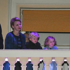 Le prince Albert II de Monaco, la princesse Charlene de Monaco et leurs enfants le prince Jacques et la princesse Gabriella assistent à la Procession du Vendredi Saint depuis le balcon du Palais princier, en compagnie du père Penzo, pendant les célébrations des fêtes de Pâques. Le 30 Mars 2018 à Monaco. © Michael Alesi/Bestimage