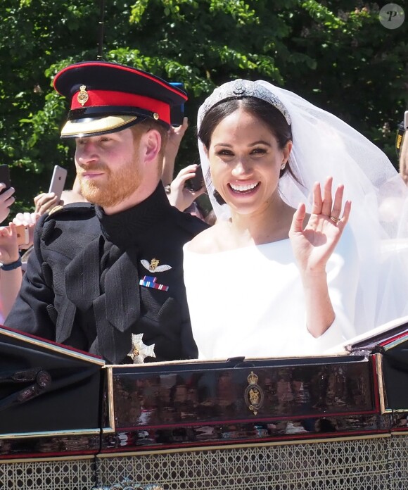 Le prince Harry et Meghan Markle, duc et duchesse de Sussex, ont effectué une procession dans le landau Ascot après leur mariage en la chapelle St George à Windsor le 19 mai 2018, à la rencontre du public dans toute la ville de Windsor et le long du Long Walk.