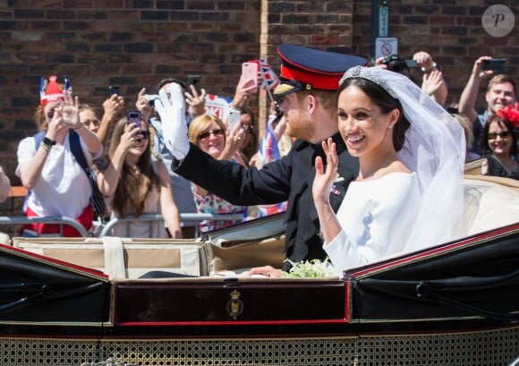 Le prince Harry et Meghan Markle, duc et duchesse de Sussex, ont effectué une procession dans le landau Ascot après leur mariage en la chapelle St George à Windsor le 19 mai 2018, à la rencontre du public dans toute la ville de Windsor et le long du Long Walk.
