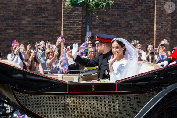Le prince Harry et Meghan Markle, duc et duchesse de Sussex, ont effectué une procession dans le landau Ascot après leur mariage en la chapelle St George à Windsor le 19 mai 2018, à la rencontre du public dans toute la ville de Windsor et le long du Long Walk.