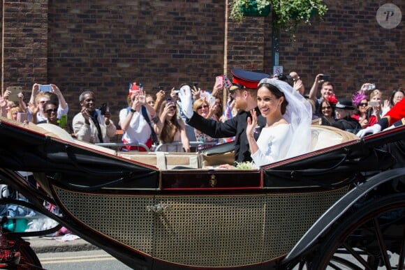 Le prince Harry et Meghan Markle, duc et duchesse de Sussex, ont effectué une procession dans le landau Ascot après leur mariage en la chapelle St George à Windsor le 19 mai 2018, à la rencontre du public dans toute la ville de Windsor et le long du Long Walk.