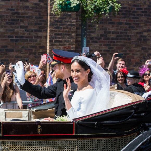 Le prince Harry et Meghan Markle, duc et duchesse de Sussex, ont effectué une procession dans le landau Ascot après leur mariage en la chapelle St George à Windsor le 19 mai 2018, à la rencontre du public dans toute la ville de Windsor et le long du Long Walk.