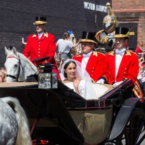 Le prince Harry et Meghan Markle, duc et duchesse de Sussex, ont effectué une procession dans le landau Ascot après leur mariage en la chapelle St George à Windsor le 19 mai 2018, à la rencontre du public dans toute la ville de Windsor et le long du Long Walk.