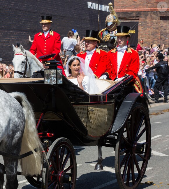 Le prince Harry et Meghan Markle, duc et duchesse de Sussex, ont effectué une procession dans le landau Ascot après leur mariage en la chapelle St George à Windsor le 19 mai 2018, à la rencontre du public dans toute la ville de Windsor et le long du Long Walk.