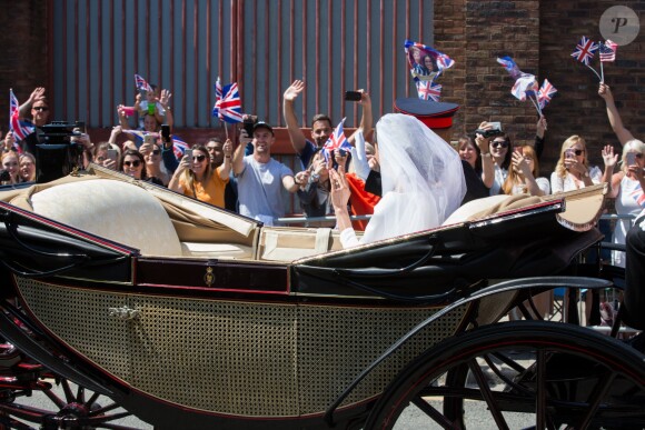 Le prince Harry et Meghan Markle, duc et duchesse de Sussex, ont effectué une procession dans le landau Ascot après leur mariage en la chapelle St George à Windsor le 19 mai 2018, à la rencontre du public dans toute la ville de Windsor et le long du Long Walk.