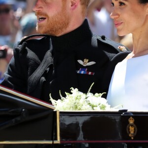 Le prince Harry et Meghan Markle, duc et duchesse de Sussex, ont effectué une procession dans le landau Ascot après leur mariage en la chapelle St George à Windsor le 19 mai 2018, à la rencontre du public dans toute la ville de Windsor et le long du Long Walk.