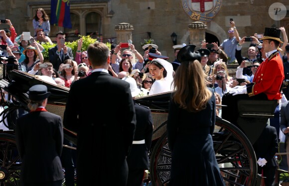 Le prince Harry et Meghan Markle, duc et duchesse de Sussex, ont effectué une procession dans le landau Ascot après leur mariage en la chapelle St George à Windsor le 19 mai 2018, à la rencontre du public dans toute la ville de Windsor et le long du Long Walk.