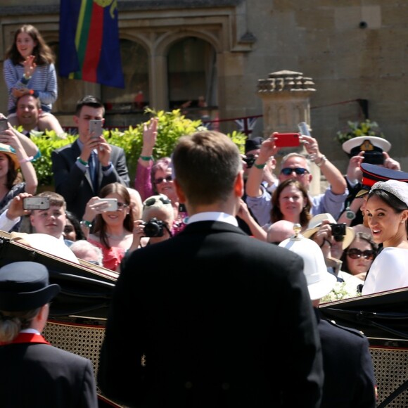 Le prince Harry et Meghan Markle, duc et duchesse de Sussex, ont effectué une procession dans le landau Ascot après leur mariage en la chapelle St George à Windsor le 19 mai 2018, à la rencontre du public dans toute la ville de Windsor et le long du Long Walk.