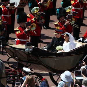 Le prince Harry et Meghan Markle, duc et duchesse de Sussex, ont effectué une procession dans le landau Ascot après leur mariage en la chapelle St George à Windsor le 19 mai 2018, à la rencontre du public dans toute la ville de Windsor et le long du Long Walk.