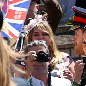 Le prince Harry et Meghan Markle, duc et duchesse de Sussex, ont effectué une procession dans le landau Ascot après leur mariage en la chapelle St George à Windsor le 19 mai 2018, à la rencontre du public dans toute la ville de Windsor et le long du Long Walk.