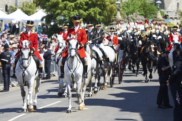 Le prince Harry et Meghan Markle, duc et duchesse de Sussex, ont effectué une procession dans le landau Ascot après leur mariage en la chapelle St George à Windsor le 19 mai 2018, à la rencontre du public dans toute la ville de Windsor et le long du Long Walk.